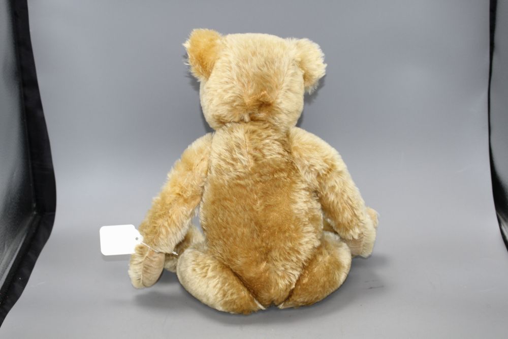 A Chiltern Hugmee bear c.1930s, 19in., blond mohair, good condition, glass eyes and velvet pads